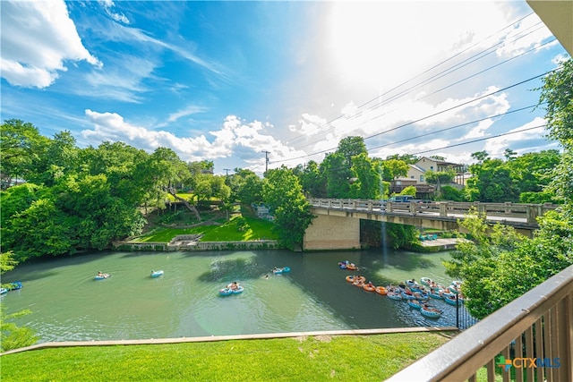 view of community with a water view