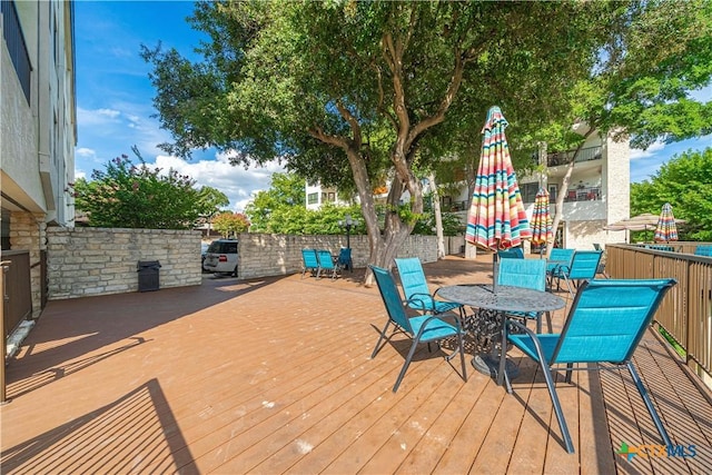 401 W Lincoln St Unit A201, New Braunfels, TX 78130 - wooden terrace with outdoor dining space