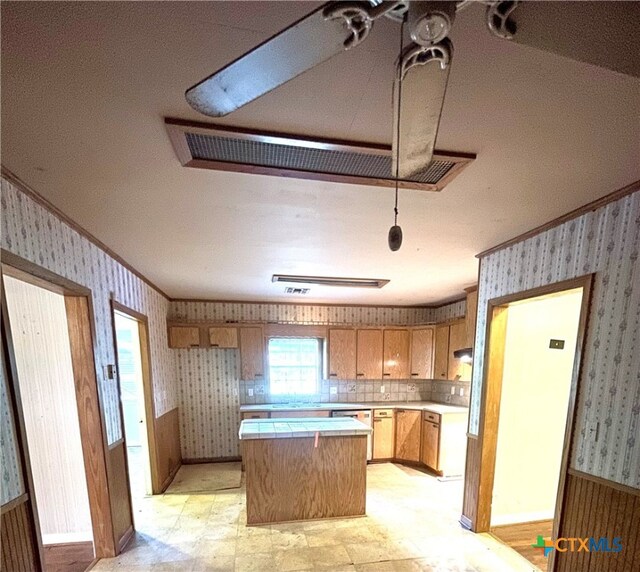 kitchen featuring tasteful backsplash and a center island