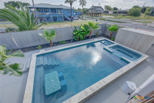521 Woodhaven Dr, Ingleside, TX 78362 - view of pool with a fenced backyard and a pool with connected hot tub