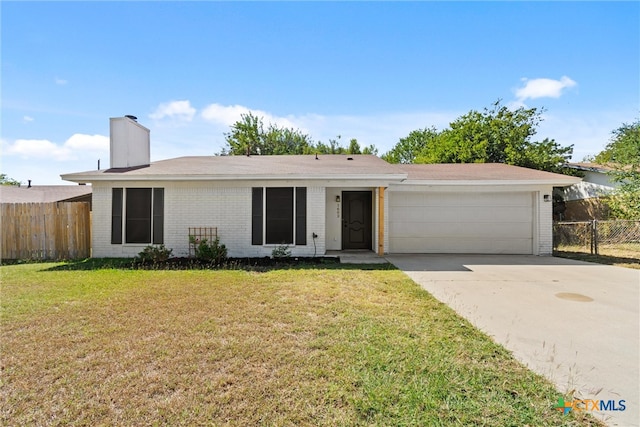 single story home with a garage and a front yard