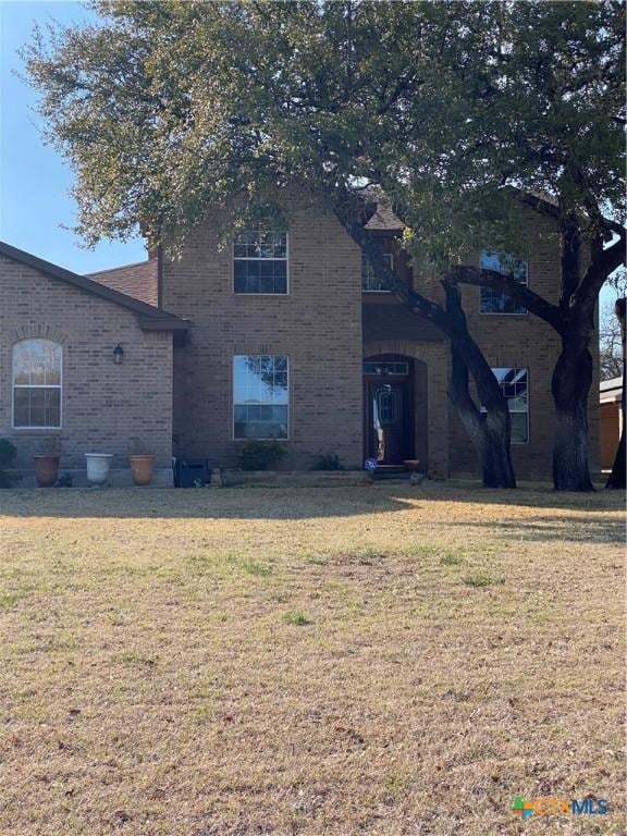 front facade with a front yard