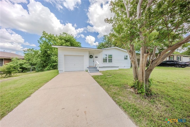 2613 Goliad St, Temple, TX 76501 - view of front facade featuring an attached garage, concrete driveway, and a front yard