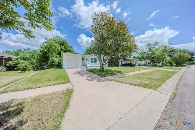 2613 Goliad St, Temple, TX 76501 - single story home featuring an attached garage, a front yard, and concrete driveway