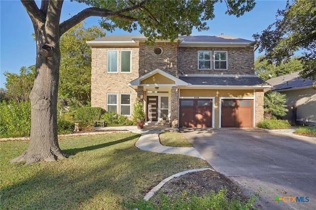 view of front of house with a front lawn and a garage