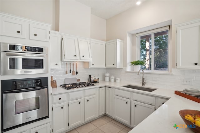 kitchen with white cabinetry, sink, and appliances with stainless steel finishes