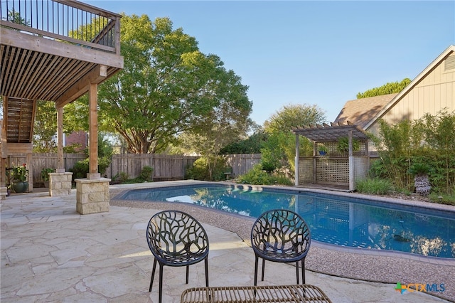 view of swimming pool featuring a pergola and a patio