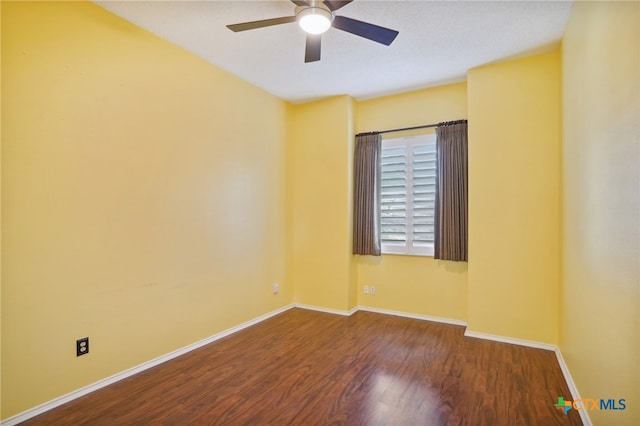 empty room with hardwood / wood-style flooring and ceiling fan