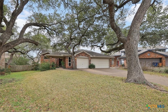 view of front of home with a garage and a front yard