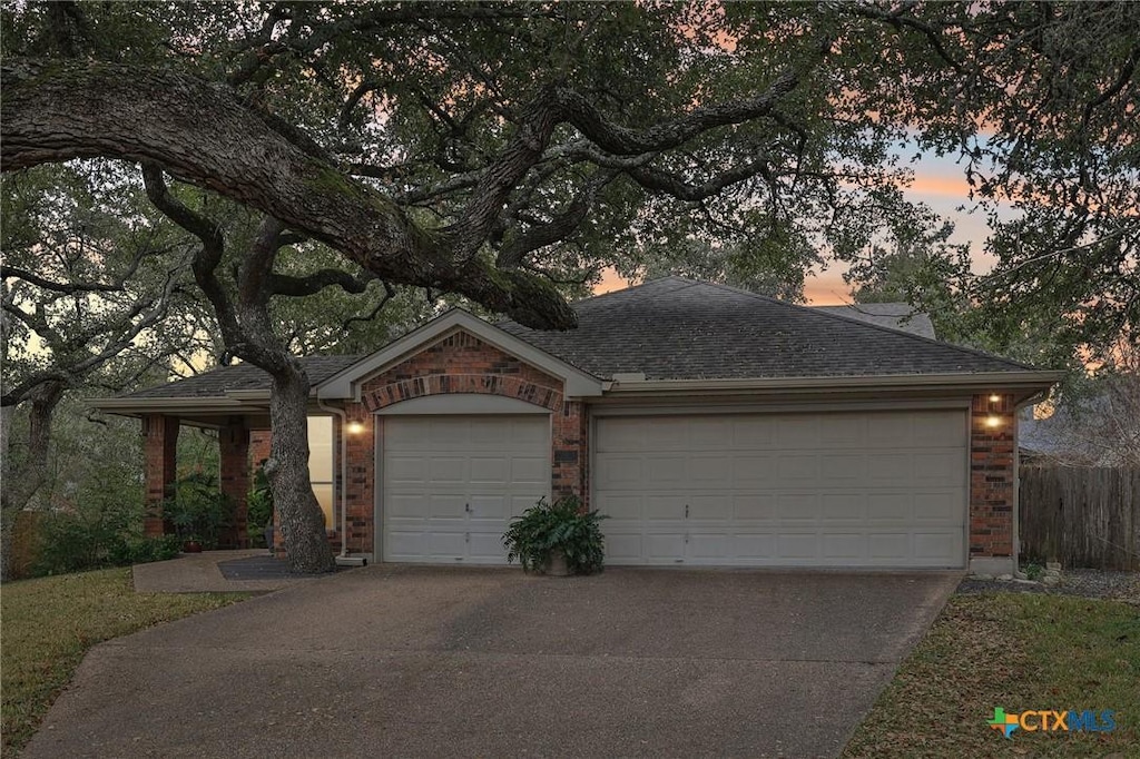 ranch-style house featuring a garage