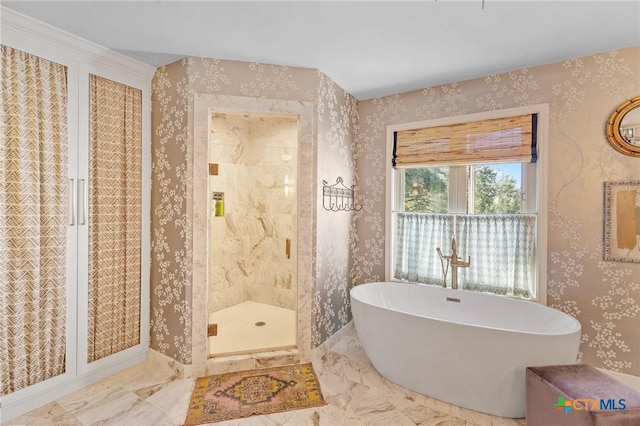 bathroom featuring crown molding and independent shower and bath