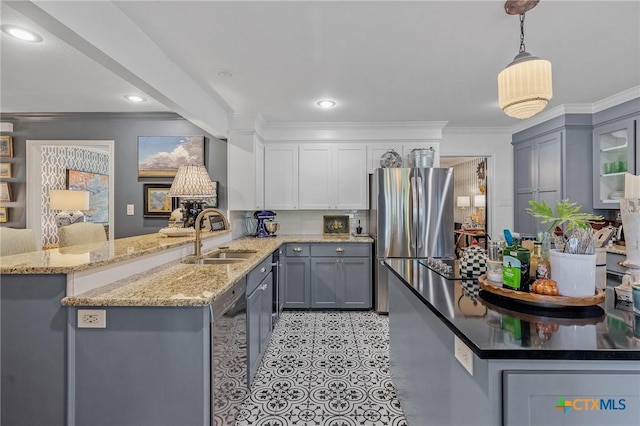 kitchen featuring gray cabinetry, crown molding, sink, decorative light fixtures, and kitchen peninsula