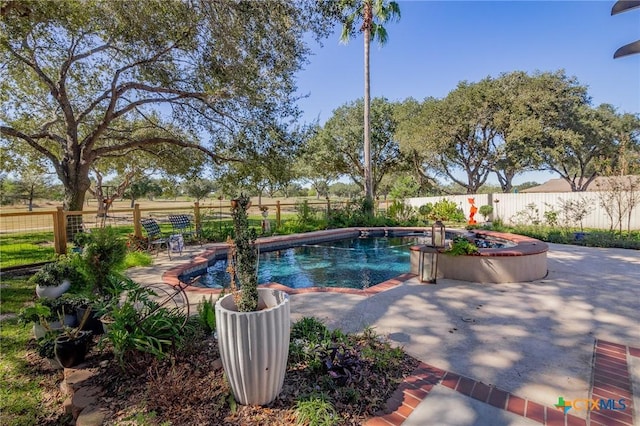 view of swimming pool with a patio