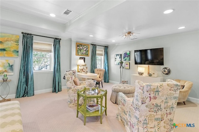 carpeted living room featuring beamed ceiling, plenty of natural light, and ornamental molding