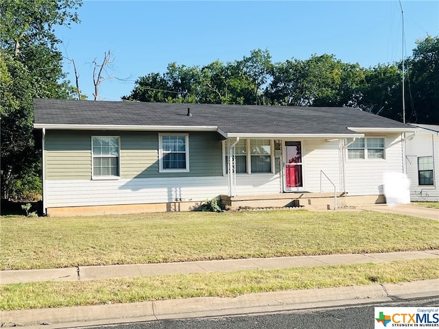 single story home featuring a front lawn