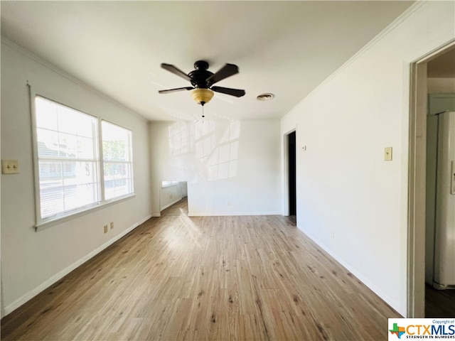 unfurnished room with light wood-type flooring, ceiling fan, and crown molding