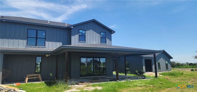 8186 S Lone Star Pkwy, Moody, TX 76657 - rear view of house with a shingled roof, a patio, and board and batten siding