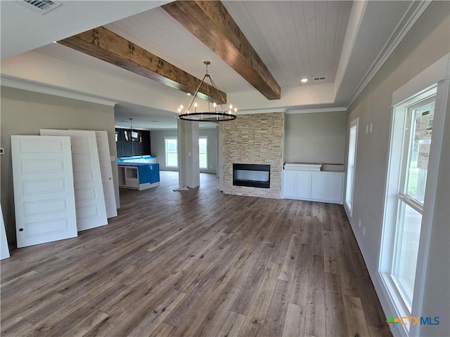 8186 S Lone Star Pkwy, Moody, TX 76657 - unfurnished living room with ornamental molding, visible vents, dark wood-style flooring, beamed ceiling, and a notable chandelier