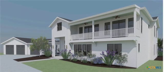 view of front of property featuring ceiling fan, a garage, an outdoor structure, and a front lawn