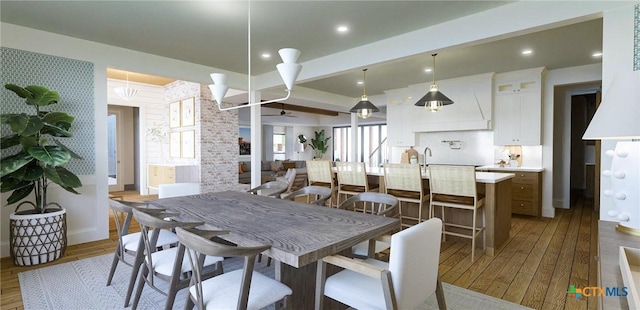 8186 S Lone Star Pkwy, Moody, TX 76657 - dining room with baseboards, beam ceiling, wood-type flooring, and a ceiling fan