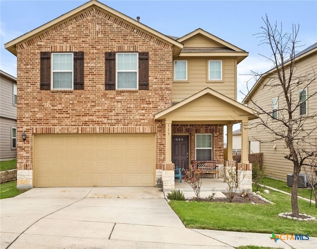 view of front of property with a garage, driveway, a porch, a front lawn, and brick siding