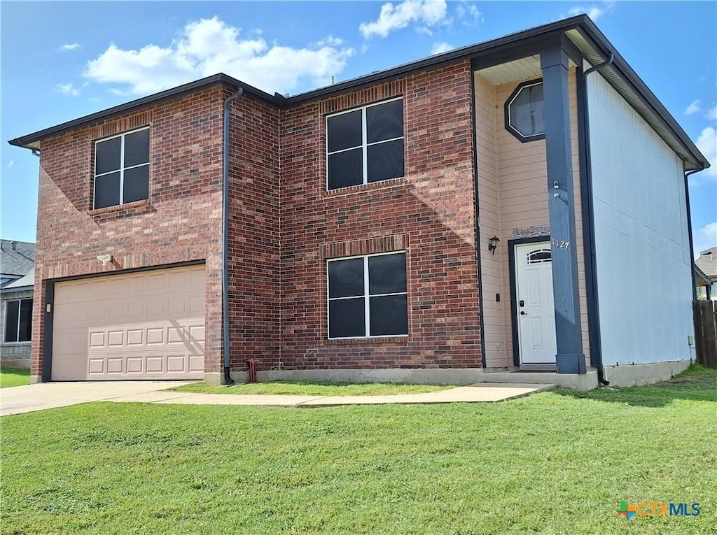 1127 Stone Arch, New Braunfels, TX 78130 - view of front facade featuring an attached garage, brick siding, a front lawn, and concrete driveway