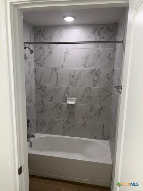 full bath with shower / bath combination and wood finished floors
