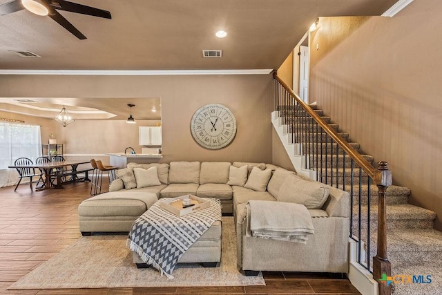 10 Long Bow Ln, Wimberley, TX 78676 - living room with hardwood / wood-style floors, ornamental molding, ceiling fan, stairway, and recessed lighting