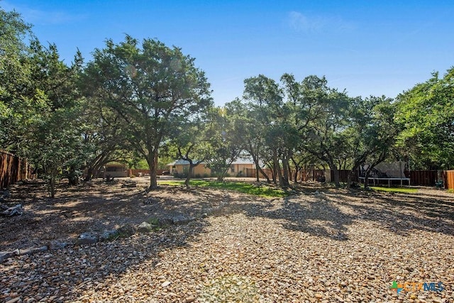 10 Long Bow Ln, Wimberley, TX 78676 - view of yard with a trampoline