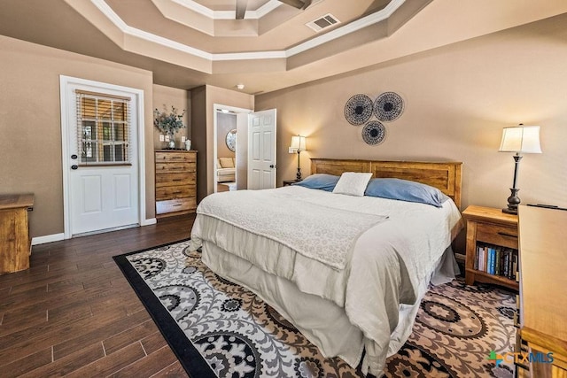10 Long Bow Ln, Wimberley, TX 78676 - bedroom with ornamental molding, wood finished floors, and a raised ceiling