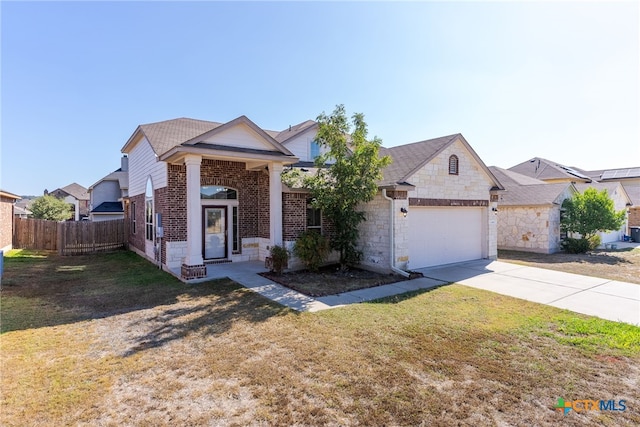 view of front facade featuring a garage and a front lawn