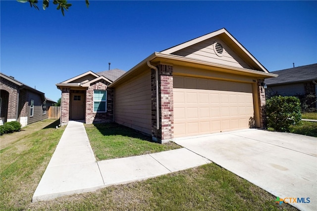 ranch-style home with a front lawn and a garage