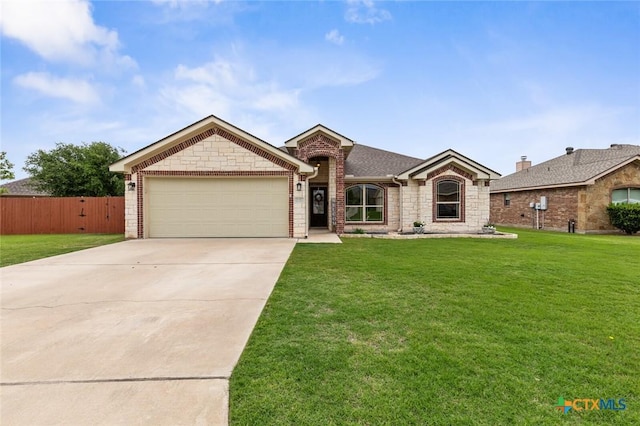 2017 Wagon Gap Rd, Temple, TX 76502 - single story home featuring a garage, a front lawn, fence, and driveway