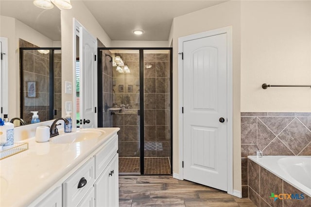 2017 Wagon Gap Rd, Temple, TX 76502 - bathroom featuring a sink, a bath, a stall shower, and double vanity