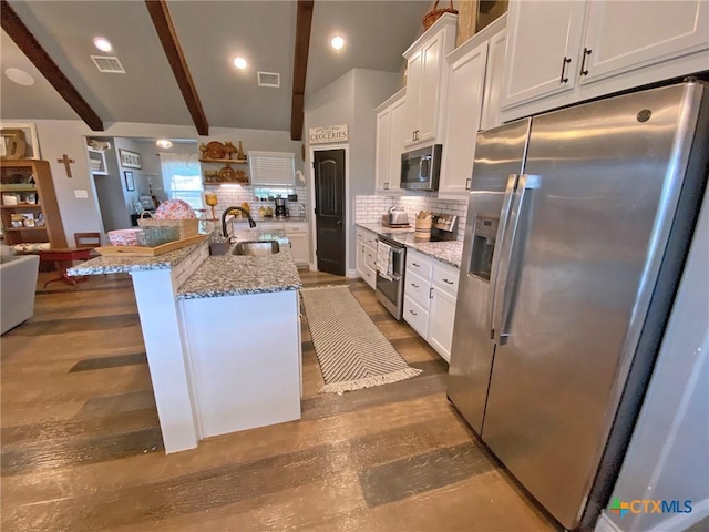 kitchen with white cabinetry, visible vents, appliances with stainless steel finishes, and a sink