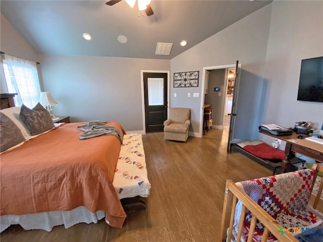 bedroom with ceiling fan, hardwood / wood-style floors, and lofted ceiling