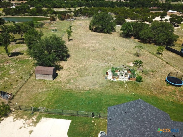 drone / aerial view with a water view and a rural view