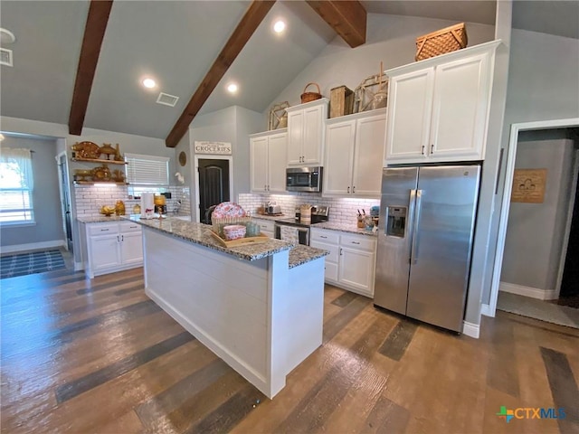 kitchen with dark wood finished floors, open shelves, appliances with stainless steel finishes, white cabinets, and beamed ceiling