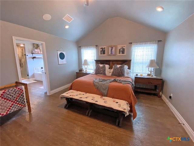 bedroom with vaulted ceiling, wood finished floors, visible vents, and baseboards