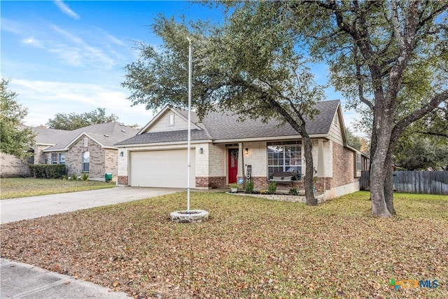 view of front of home with a garage and a front lawn