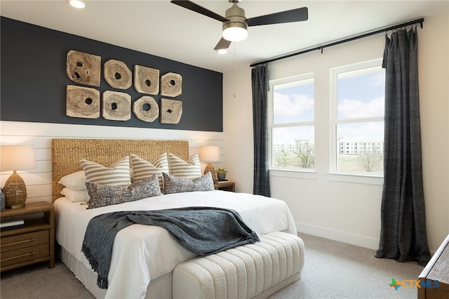 bedroom with light carpet and ceiling fan