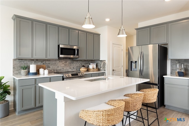 kitchen featuring gray cabinets, sink, and stainless steel appliances