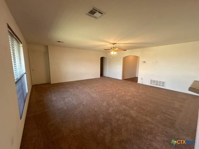 carpeted spare room with ceiling fan