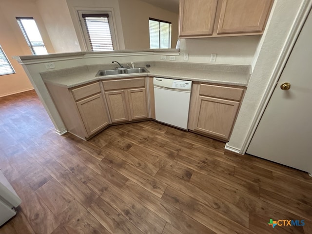 kitchen featuring white dishwasher, light brown cabinetry, dark hardwood / wood-style floors, and sink