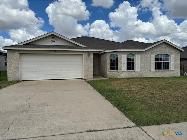 ranch-style home featuring a garage and a front yard