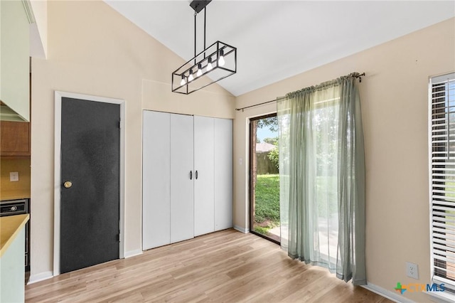 515 Camelot Dr, Victoria, TX 77901 - unfurnished dining area featuring vaulted ceiling and light wood-type flooring