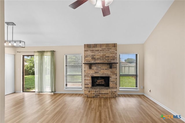 515 Camelot Dr, Victoria, TX 77901 - unfurnished living room with wood finished floors, ceiling fan, and a fireplace