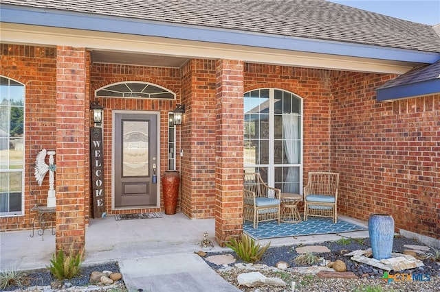 entrance to property featuring a porch