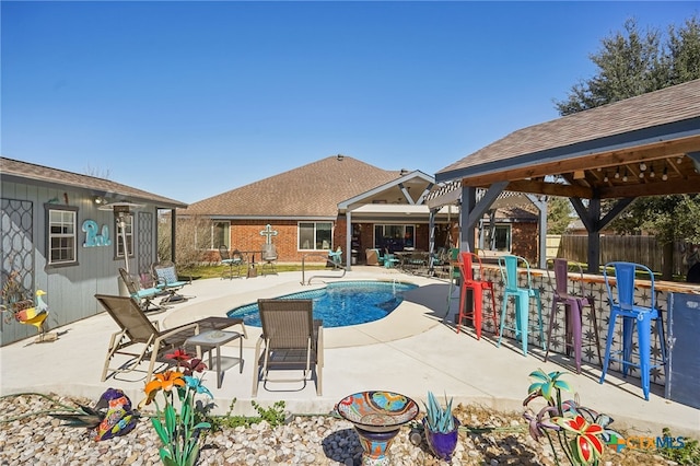 view of swimming pool with a gazebo and a patio area