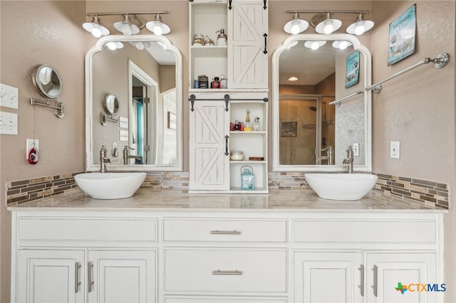 bathroom featuring tasteful backsplash, vanity, and walk in shower